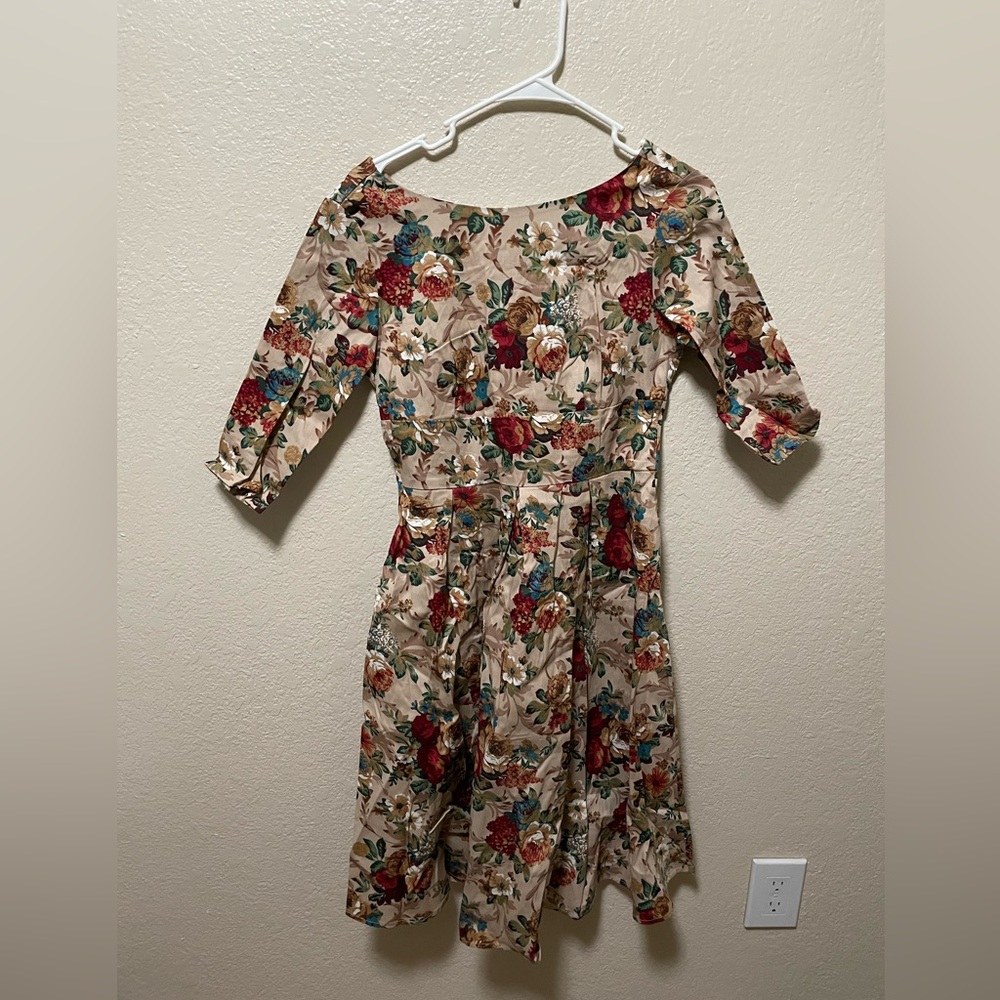 Size small. Floral dress. Never worn